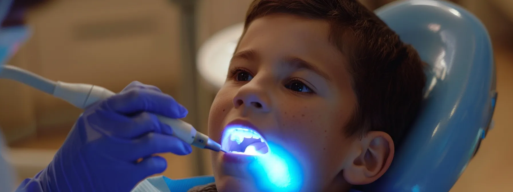 a child receiving a fluoride treatment and dental sealant at starting point dental care in prairie village.